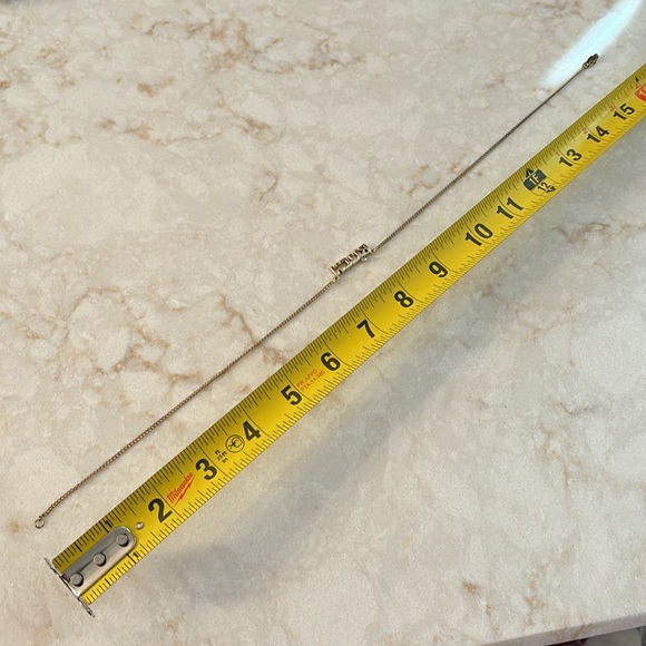 A gold toned and rhinestone necklace - Picture 6 of 7